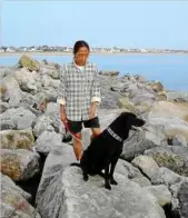  ??  ?? yunqi enjoying the beach in Grenoble last december, with his owner Ivan Len. — Photo by Laurent Corric