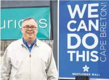  ?? JEREMY FRASER/CAPE BRETON POST ?? Greg Morrison, manager of Mayflower Mall, stands near the Sydney mall’s new sign, which encourages positivity during and post COVID-19.