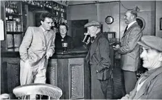  ??  ?? Burton, 1953, with his father, centre, in Wales, and onstage in Camelot, below