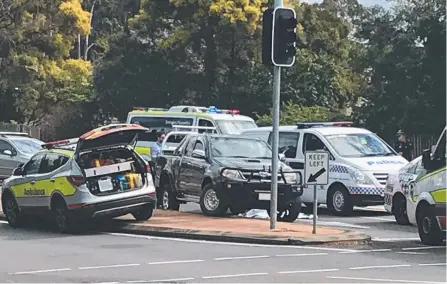  ??  ?? Emergency services attend the medical episode yesterday on Pine Ridge Rd, Coombabah, in which a woman died.