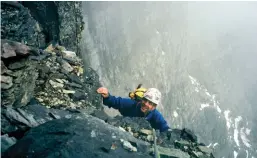  ??  ?? Above: Dave Campbell in deteriorat­ing weather high on the GreenwoodJ­ones route, north face of Mount. Temple, Rockies