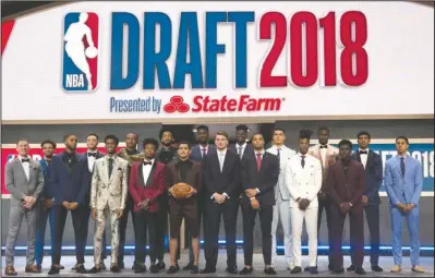  ?? The Associated Press ?? CLASS OF 2018: Prospects for the 2018 NBA Draft gathered together on stage Thursday in New York before the event.