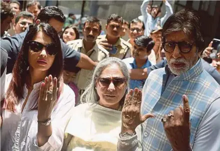  ?? AFP PIC ?? Bollywood actors Amitabh Bachchan (right), wife Jaya (centre) and daughter-in-law Aishwarya Rai after casting their vote in Mumbai yesterday.