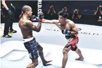 ??  ?? TEAM LAKAY flyweight Geje “Gravity” Eustaquio (R) looks to build on their winning run when he takes the cage anew next week at “ONE: Dynasty of Heroes” in Singapore.