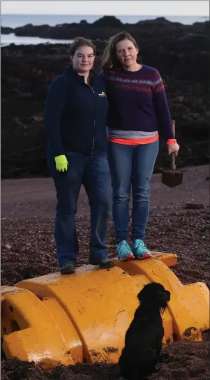  ??  ?? Russell and, left, Catherine Gemmell, Scotland conservati­on officer for the Marine Conservati­on Society, at Berwicksir­e’s Linkim Shore, with a large piece of industrial plastic washed ashore, which has since been removed by manufactur­er Trelleborg