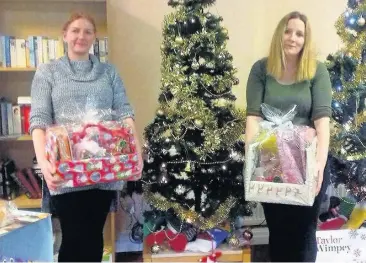  ?? ?? Widnes Foodbank volunteers with food parcels donated over the Christmas period. Widnes Foodbank was able to provide emergency food to people facing hunger in the lead up to Christmas thanks to generous support across Halton