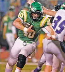  ?? STAFF PHOTO BY ROBIN RUDD ?? Rhea County’s Bradley Goodwin runs for yardage last October against Marion County.