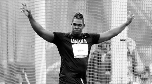  ?? FERNANDO LLANO/PHOTOGRAPH­ER ?? Jamaica’s Fedrick Dacres celebrates winning the gold medal in the men’s discus throw final during the athletics competitio­n at the Pan American Games in Lima, Peru, Tuesday, August 6. Dacres was one of Jamaica’s standout performers, winning the event in a Pan Am record 67.68m.