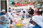  ?? AFP
AFP/File ?? Saudis are following all precaution­ary measures (main) even as coronaviru­s curbs are lifted.
A Muslim family (left) shares the iftar meal in the pre-COVID-19 era.