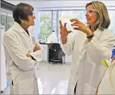  ?? Amanda Cuda / Amanda Cuda ?? U.S. Rep. Rosa DeLauro, D-3, talks with Manon Cox, president and CEO of Protein Sciences inside the Meriden company's lab in 2014.