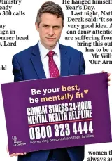  ??  ?? SUPPORT: Gavin Williamson with the card bearing the vital helpline number