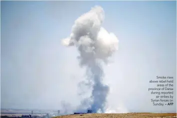  ?? — AFP ?? Smoke rises above rebel-held areas of the province of Daraa during reported air strikes by Syrian forces on Sunday.