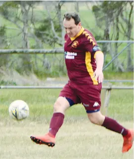  ??  ?? Llewellyn Friend controls the ball for the Drouin Dragons during a comprehens­ive 13-0 win in the men’s reserves against Prom Coast on Sunday.