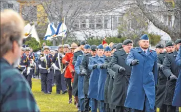  ?? PHOTOS BY COLIN CHISHOLM AND ALLIE SALTZMAN ?? The Windsor Remembranc­e Day ceremony kicks off with a parade, including current and former members of the Canadian Armed Forces as well as members of the RCMP, Windsor Fire Department and more.