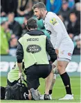  ??  ?? Concern: Elliot Daly is treated for a knee injury in Wasps’ victory over Northampto­n