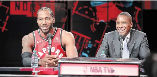  ?? STEVE RUSSELL TORONTO STAR ?? Raptors forward Kawhi Leonard, left, and team president Masai Ujiri are all smiles during media day Monday before going to Vancouver for training camp.