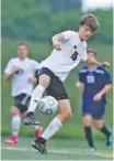  ??  ?? Signal Mountain’s Max Burk takes control of the soccer ball during the Eagles’ region title win Thursday. He scored their goal.