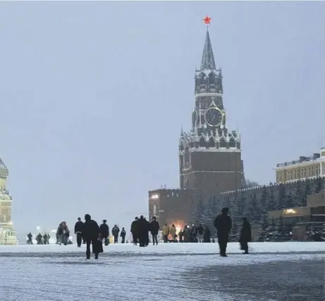  ??  ?? 0 People walk across Moscow’s Red Square with St Basil Cathedral, left, while the Kremlin’s Spassky Tower can be seen