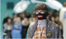  ??  ?? A model for Gucci’s autumn/winter 2018-19 collection is seen at Milan fashion week. Photograph: Antonio Calanni/AP