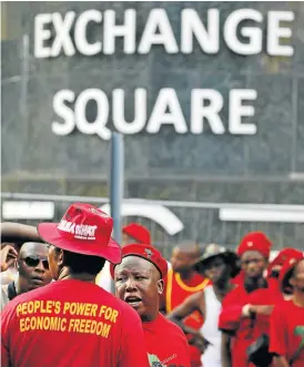  ?? /Reuters ?? Red flags: EFF leader Julius Malema, centre, at a protest outside the Johannesbu­rg Stock Exchange in 2016. The party is calling for the poor to have a greater share in SA’s wealth.