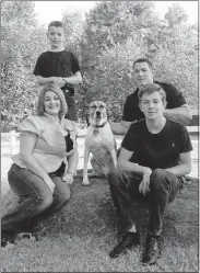  ?? [PHOTO PROVIDED] ?? Colton Schneider (front right) with his mother Angie Schneider, brother Layton Schneider and father Andy Schneider. Colton, an Edmond North wrestler, died in 2015.