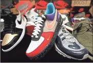  ?? Gary Coronado/los Angeles Times/tns ?? Nike Inc.’s relationsh­ip with its shoe-collecting followers has taken a hit because of a controvers­y involving a top executive and her shoe reseller son. Shown here is a small portion of one collector’s trove.