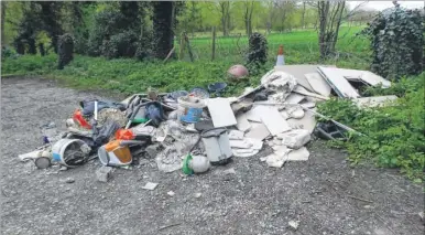  ??  ?? Rubbish including chicken manure dumped outside Eastwell Church