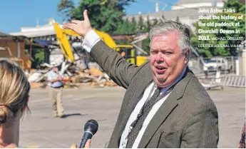  ?? MICHAEL DOSSETT/
COURIER JOURNAL VIA AP ?? John Asher talks about the history of the old paddock at Churchill Downs in 2013.