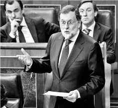  ??  ?? Rajoy gives a speech during a session of the Lower House of Parliament in Madrid. — AFP photo