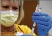  ?? LACKEY / STAFF BILL ?? Nurse Lynn DiLoreto draws a vaccine dose at the Champaign County Government Center.