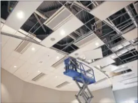  ??  ?? Wright State is preparing to cut the ribbon April 16 on its Neuroscien­ce Engineerin­g Collaborat­ion Building, a site the university says will “spawn pioneering research and medical breakthrou­ghs.” The ceiling of the auditorium is being completed.