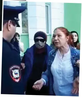  ?? ?? Face of fury: A demonstrat­or confronts police in Dagestan