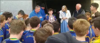  ??  ?? Captain Darragh Sweeney proudly accepts the Rose Shield from 2015 Rose of Tralee Elysha Brennan after their victory in the final.