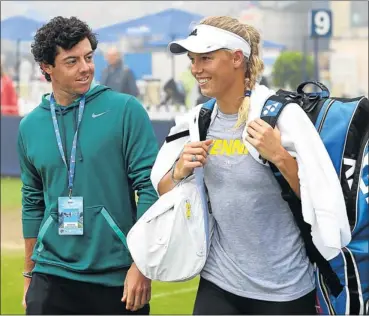  ?? Picture: JAN KRUGER/GETTY IMAGES ?? HAPPY DAYS: Northern Irish golf star Rory McIlroy and his superstar girlfriend, top-10 tennis player Caroline Wozniacki, of Denmark, whose longrunnin­g romantic relationsh­ip is reported to be on the rocks.