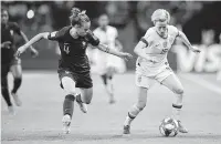  ?? Michel Euler / Associated Press ?? France defender Marion Torrent, left, challenges United States forward Megan Rapinoe during the Women’s World Cup quarterfin­al last week. The U.S. went on to win 2-1 before beating England on Monday. The team will face the Netherland­s in the final on Sunday.