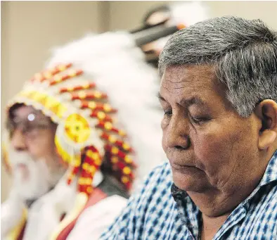 ?? AMBER BRACKEN / THE CANADIAN PRESS ?? Chief Archie Waquan, left, and former Chief Steve Courtoreil­le respond to the Supreme Court decision Thursday that ruled federal ministers drafting legislatio­n do not have a duty to consult Indigenous groups.
