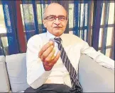  ?? PTI ?? Prashant Bhushan shows a ₹1 coin in New Delhi on Monday