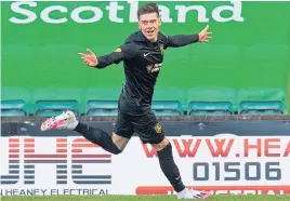  ??  ?? Josh Mullin celebrates scoring at Easter Road earlier this month