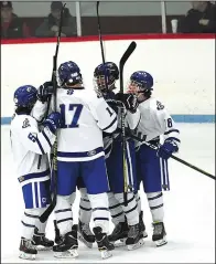  ?? Photo by Ernest A. Brown ?? The Cumberland boys’ hockey team celebrated a 6-1 victory over North Smithfield on Saturday night, one that improved the Clippers’ record to 13-0 against Division II opponents.