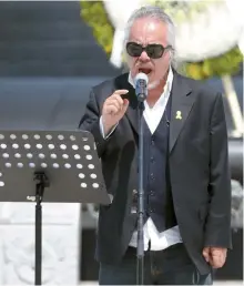  ?? Yonhap ?? Rock singer Jeon In-kwon performs the song “Evergreen Tree” at the 37th ceremony commemorat­ing the 1980 Gwangju pro-democracy movement, at the May 18th National Cemetery in the southweste­rn city, Thursday.
