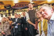  ?? Dario Pignatelli / Bloomberg ?? People at the James Joyce pub in Brussels, Belgium, watch Parliament’s vote on the Brexit deal.