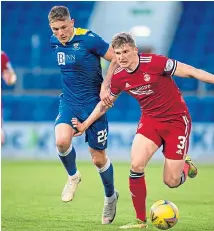  ?? ?? Left: St Johnstone’s Dan Cleary and Murray Davidson block Connor MacLennan; above: Callum Hendry chases down Jack MacKenzie.