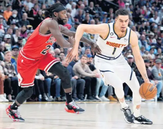  ?? DAVID ZALUBOWSKI/AP ?? Bulls coach Billy Donovan says point guard Patrick Beverley, guarding Nuggets forward Michael Porter Jr., seems to thrive under adversity.