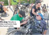  ??  ?? Pit stop Recyke-abike mechanics help the hand cyclists