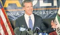  ??  ?? RELIEF: Gov. Gavin Newsom basks in victory Tuesday night.