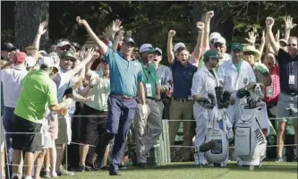  ?? MATT SLOCUM, THE ASSOCIATED PRESS ?? Matt Kuchar reacts after his hole-in-one on the 16th hole during the final round of the Masters Sunday.