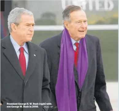  ?? Photo / AP ?? President George H. W. Bush (right) with son George W. Bush in 2008.