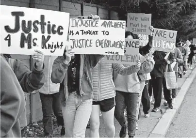  ?? KIM HAIRSTON/BALTIMORE SUN ?? Students from Bryn Mawr, Gilman and Roland Park Country School hold up signs calling for better treatment of Black teachers and staff members.