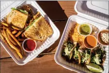  ?? ?? LEFT: A Philly cheesestea­k with fries and steak tacos with rice, beans, avocado cream and house-made ricotta are some of the offerings at La Carreta food truck off of Paseo del Pueblo Sur. RIGHT: Steak tacos with rice and beans are pictured. ‘For me it’s easier because I have my own recipes and my own ideas, and I prep and cook. It’s small, but it’s more free,’ Galindo said.