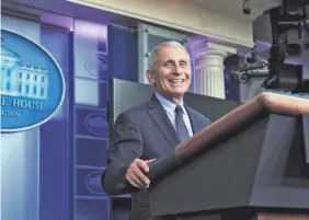  ?? ALEX BRANDON/AP ?? Dr. Anthony Fauci, the nation’s leading infectious diseases expert, smiles last month during a lighter moment at a news briefing. On Wednesday, Fauci detailed a new syndrome for people who suffer after COVID-19.